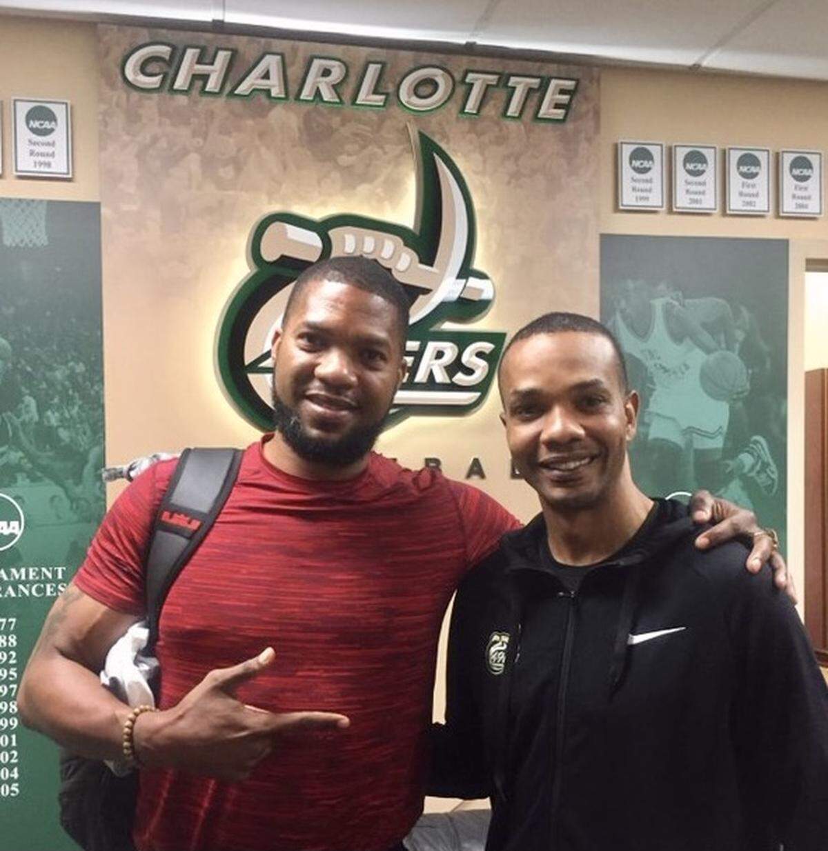 In a photo posted in 2018 by Charlotte 49ers basketball coach Ron Sanchez (right), former Charlotte 49ers basketball standout Galen Young visited his old school.