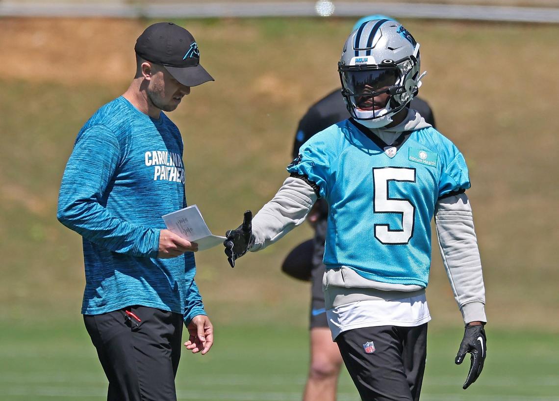Carolina Panthers wide receiver Diontae Johnson, right, receives instructions during the team’s voluntary minicamp practice on Tuesday, April 23, 2024.