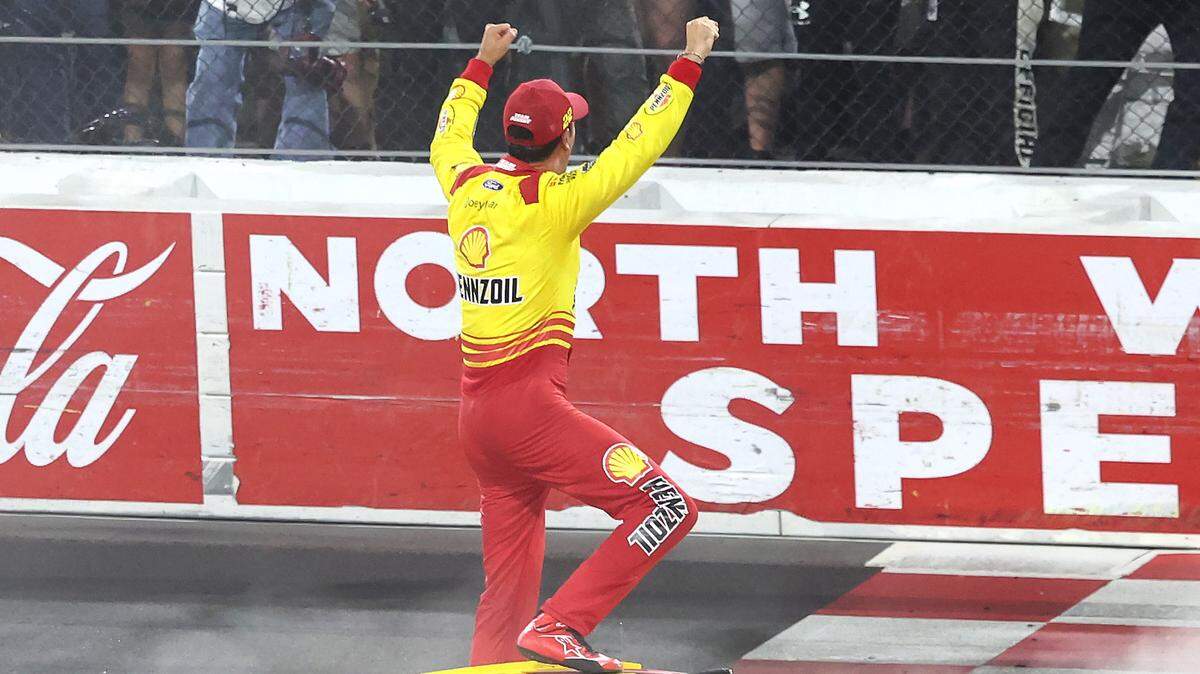 NASCAR Cup Series driver Joey Logano celebrates winning the NASCAR All-Star race with the fans at the finish line at North Wilkesboro Speedway in North Wilkesboro, NC on Sunday, May 19, 2024.
