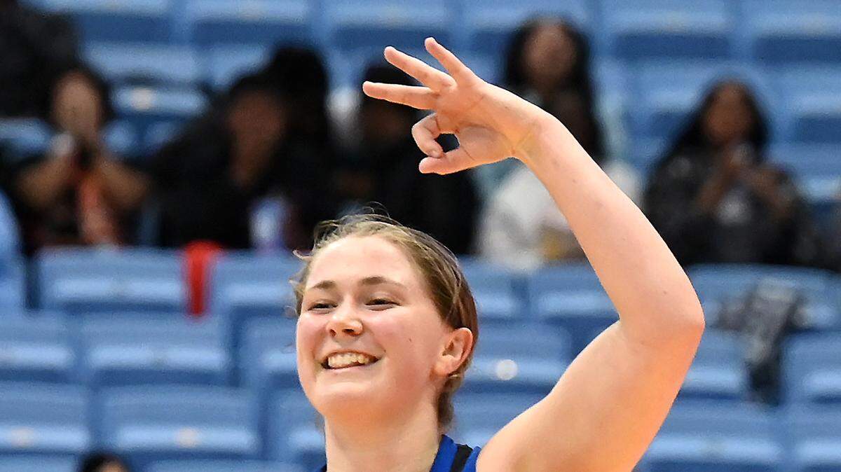 Lake Norman’s Kelsey Rhyne celebrates a three-point basket during action against Panther Creek in the NCHSAA state 4A championship game at the Dean Smith Center on Saturday, March 11, 2023. Lake Norman lost to Panther Creek 75-65.