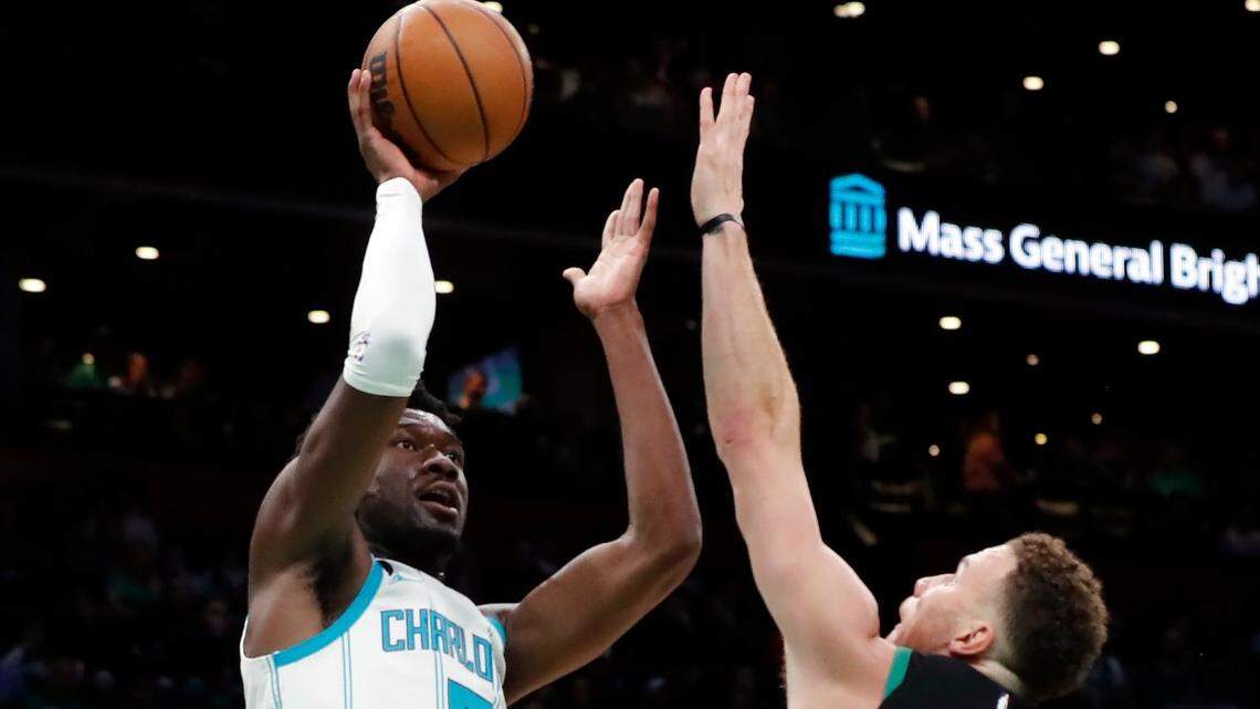Charlotte Hornets’ Mark Williams (5) shoots over Boston Celtics’ Blake Griffin (91) during the first half of an NBA basketball game, Friday, Feb. 10, 2023, in Boston. (AP Photo/Michael Dwyer)