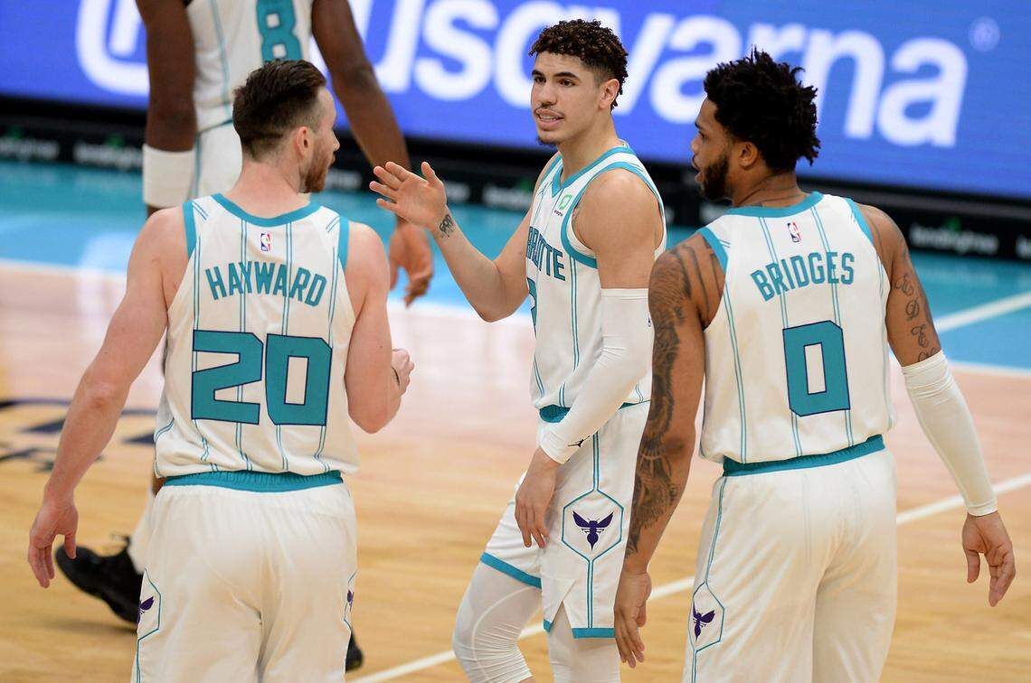 Adding Gordon Hayward (left) and rookie LaMelo Ball (center) has helped the Charlotte Hornets turn into a postseason contender during the 2020-21 NBA season.