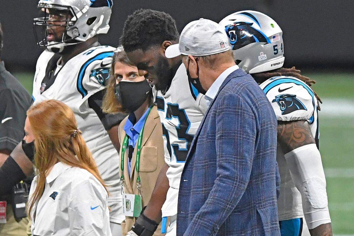 Carolina Panthers defensive end Brian Burns (53) is escorted off the field after an injury against the Atlanta Falcons in the first half at Mercedes-Benz Stadium in Atlanta, GA on Sunday, October 11, 2020. The Panthers won 23-16.