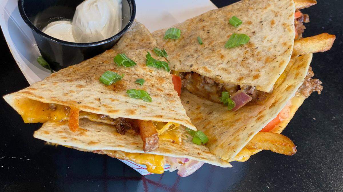 The Burger & Fries Quesadilla is a complete meal for only $10 at What the Fries.