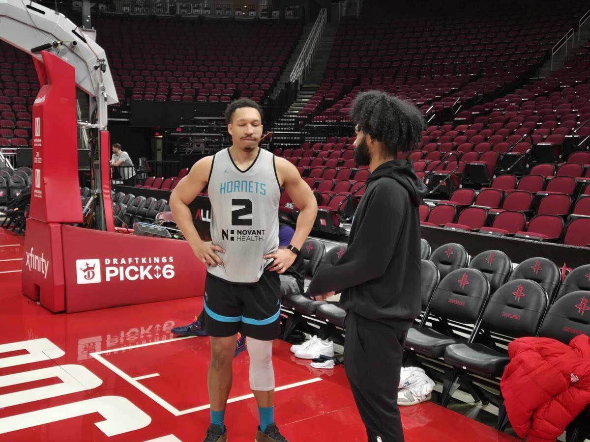 Coby White, right, chats with Grant Williams after shootaround a day after being acquired from Chicago.