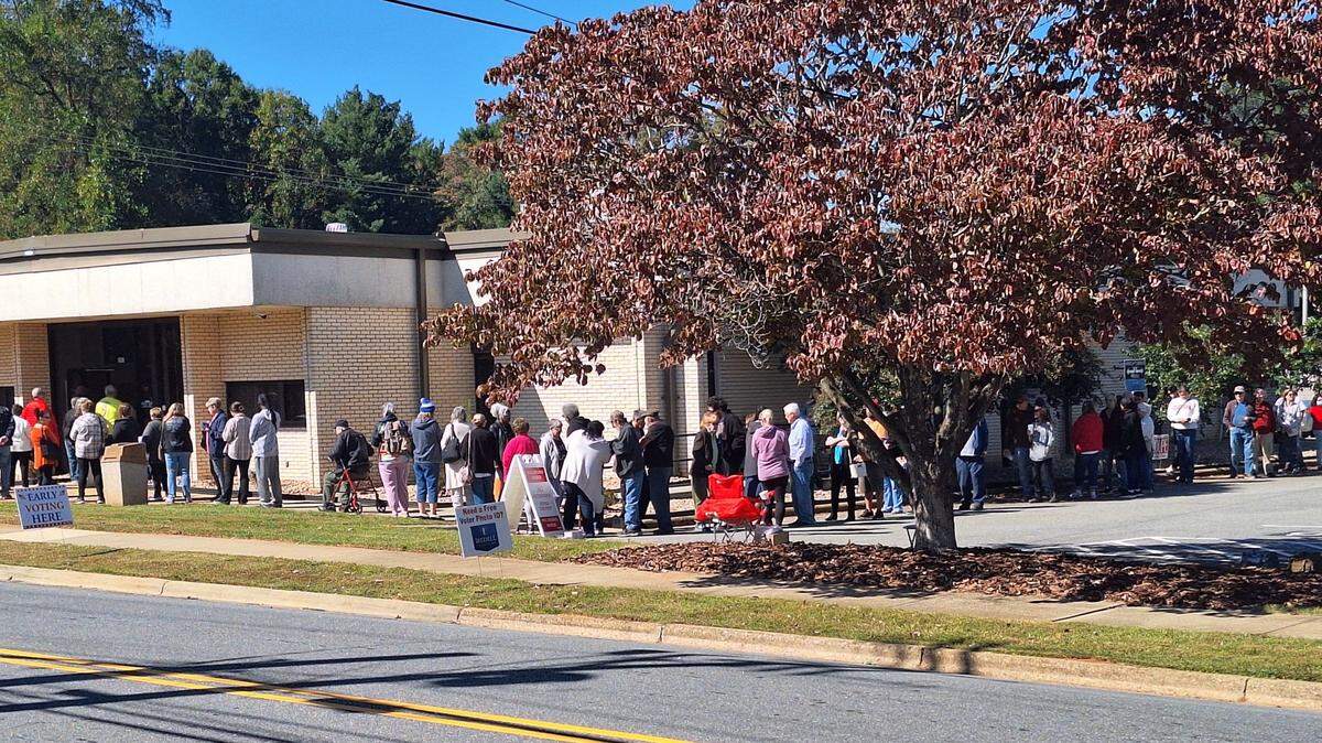 At least 200 voters were lined up outside the Iredell County Board of Elections in downtown Statesville around 12:20 p.m. Thursday on opening day of early voting.
