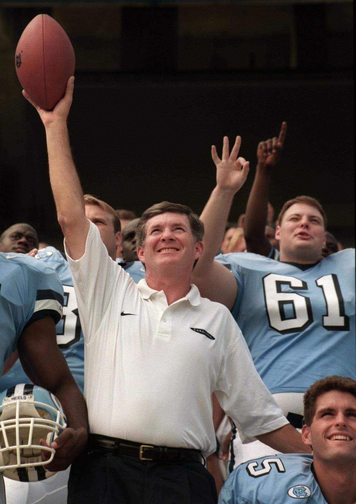 UNC coach Mack Brown and his players ham it up for a team photo at the team’s picture day at Kenan Stadium in Chapel Hill in 1997.