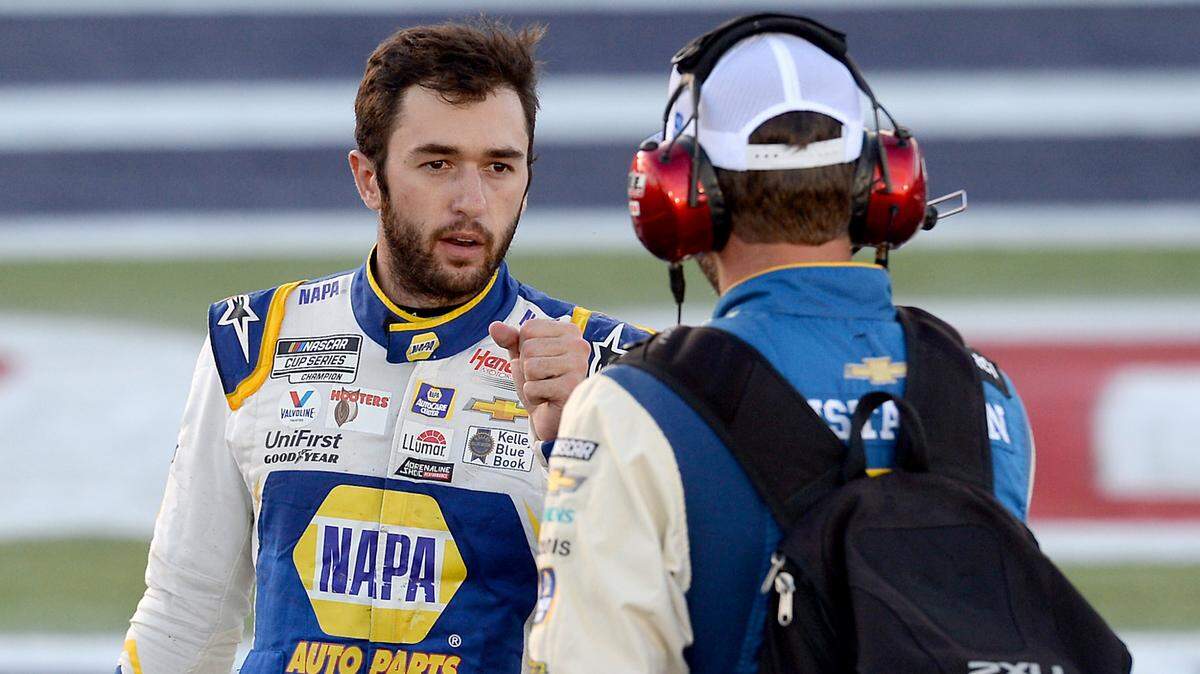 NASCAR driver Chase Elliott reaches out to bump fists with his crew chief, Alan Gustafson following the Bank of America Roval 400 at Charlotte Motor Speedway in Concord, NC on Sunday, October 10, 2021.