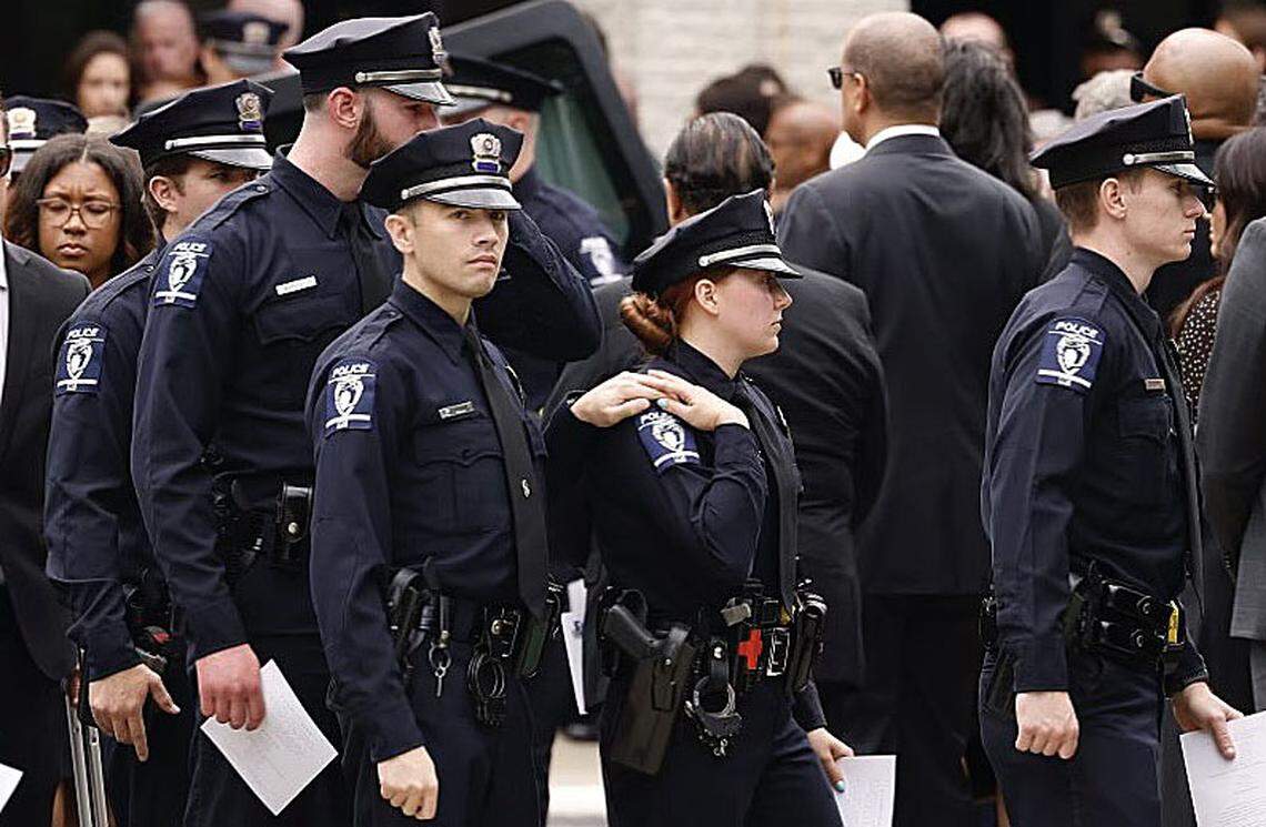 Law officers comfort each other outside First Baptist Church after the memorial service for officer Joshua Eyer on Friday, May3, 2024. Officer Eyer was killed while serving a warrant in east Charlotte on Monday, April 29, 2024