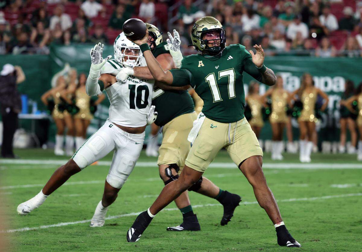 South Florida Bulls quarterback Byrum Brown (17) throws the ball against the Charlotte 49ers during the second half at Raymond James Stadium. 