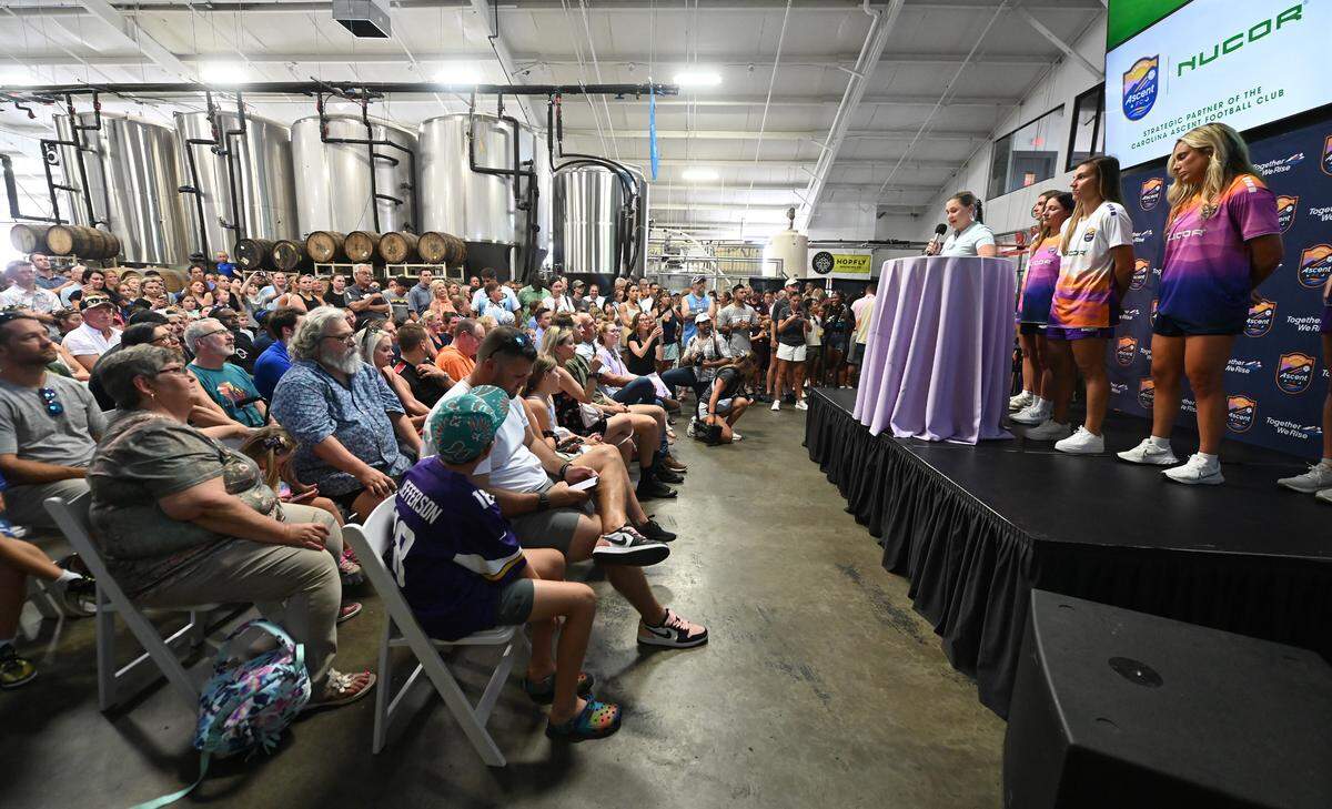 Fans and supporters attend the Carolina Ascent FC soccer team reveal party of the their new home and away jerseys on Wednesday, July 10, 2024 at HopFly Brewing in Charlotte, NC.