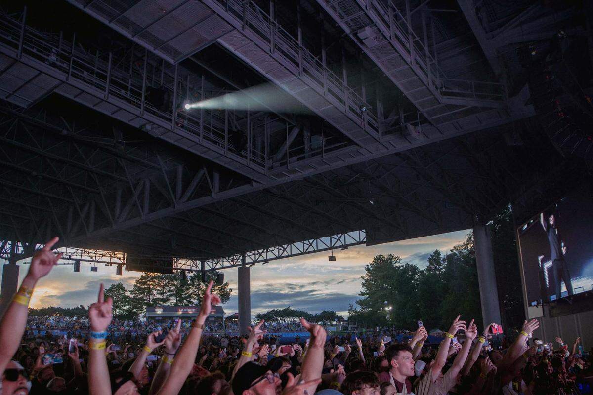 Crowded down front, but if you look closely — there are lots of empty blue seats toward the back of the pavilion.