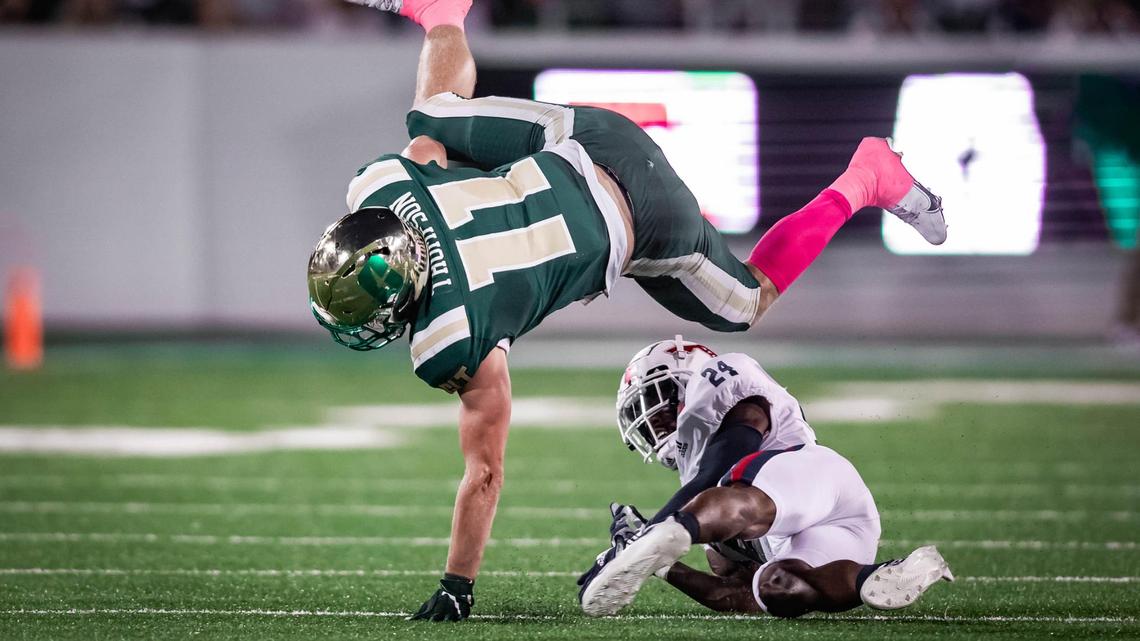 Charlotte’s Taylor Thompson (11) picks up the 1st down. Charlotte would host Florida Atlantic at Jerry Richardson Stadium Thursday October 21, 2021.
