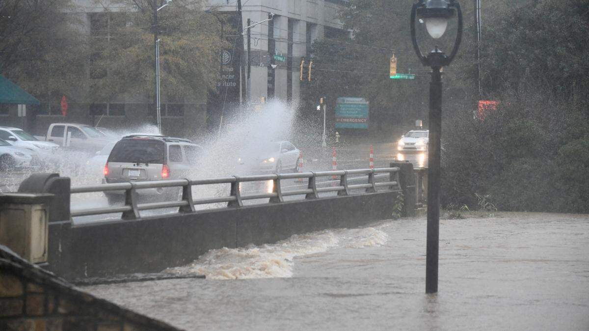 Floodwaters reach the bridge off S Kings Drive.