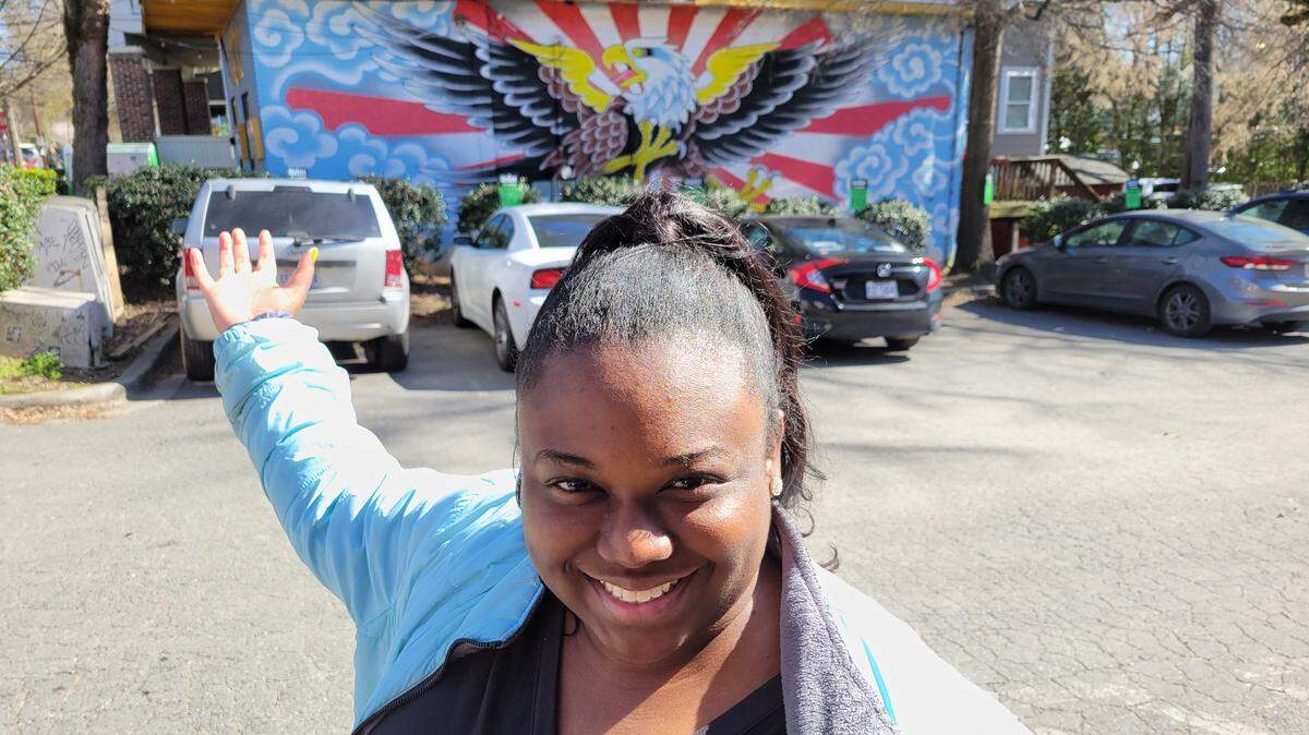 A mural walk in NoDa was among Katrina Wilson’s staycation plans. She’s shown here with the eagle mural at 510 Expert Tattoos by artist Tom Michael.