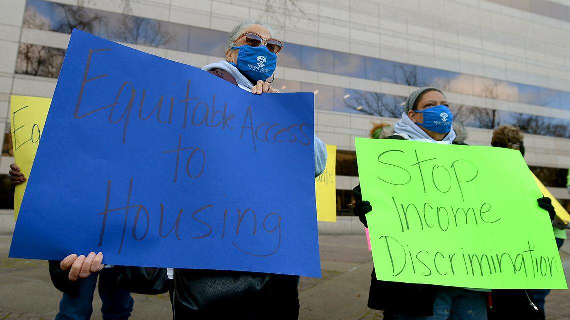 Citizens rally outside the Charlotte-Mecklenburg Government Center on Feb. 22, 2021 in support of Charlotte’s Fair Housing Ordinance, which protects people who pay for housing with vouchers, a federal subsidy that helps renters with monthly payments.