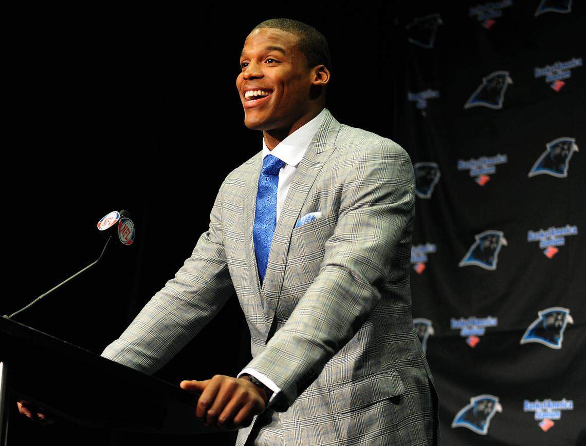 Carolina Panthers quarterback Cam Newton smiles as he addresses the media Friday during his introductory press conference at Bank of America Stadium in Charlotte. The Panthers chose Newton with the No. 1 pick in the 2011 NFL Draft April 29, 2011.