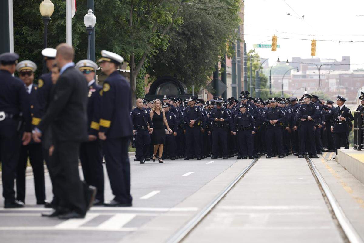 Law officers line up for the processional of Charlotte-Mecklenburg Police Officer Eyer on Friday to First Baptist Church on Friday, May3, 2024. Officer Eyer was killed while serving a warrant in east Charlotte on Monday, April 29, 2024