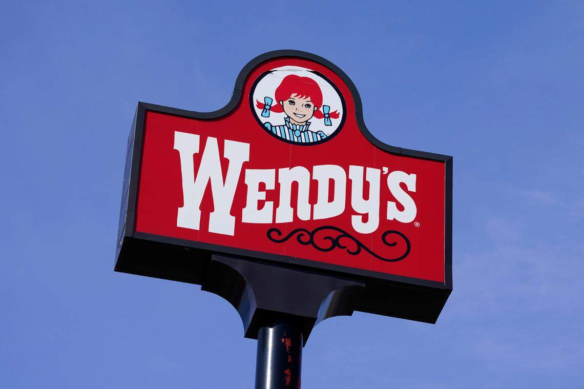 This Thursday, Feb. 25, 2021, photo shows a sign over a Wendy’s restaurant in Des Moines, Iowa. (AP Photo/Charlie Neibergall)