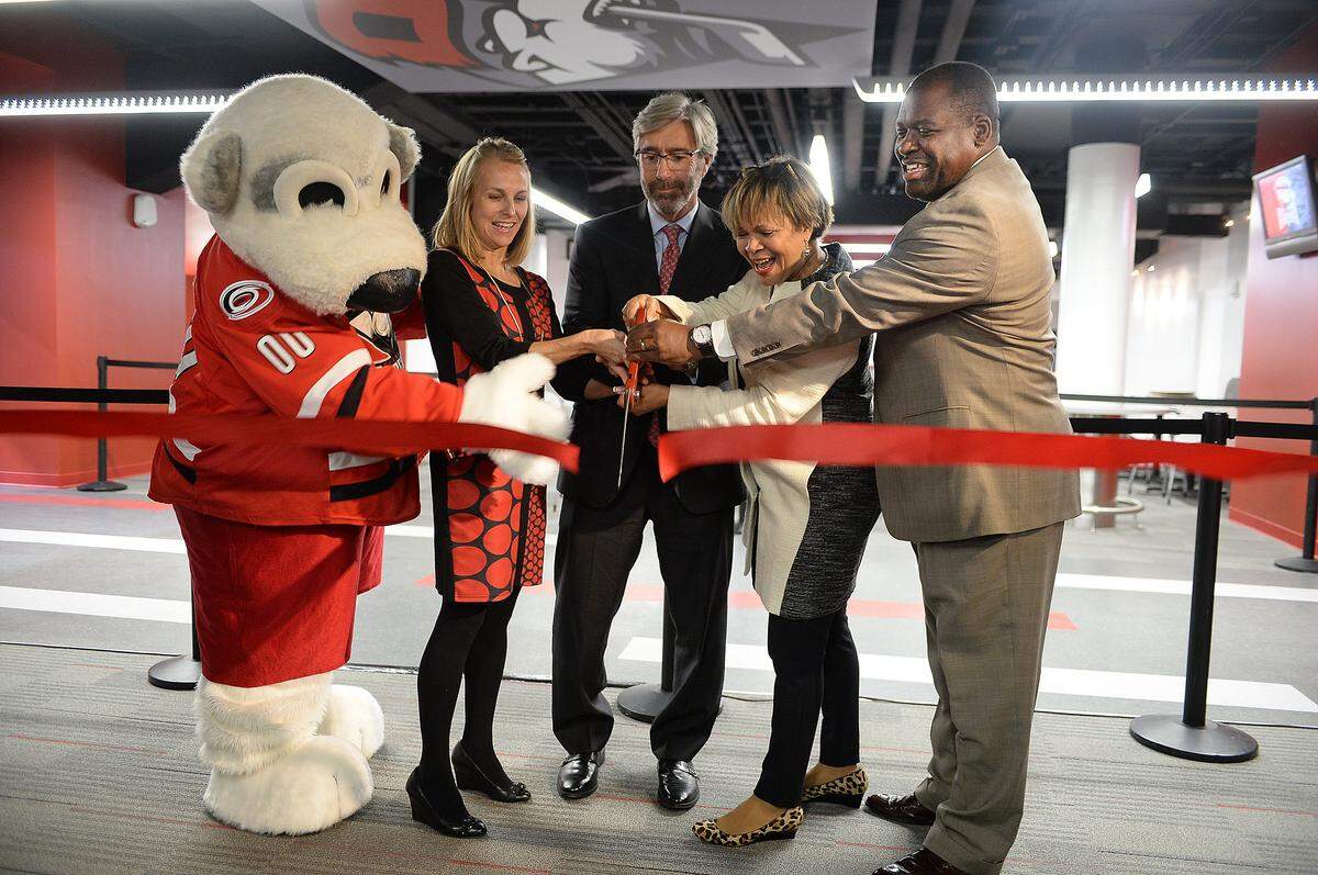 Charlotte Checker mascot, Chubby, Tara Black, Chief Operating officer for the Checkers, Tom Murray, CEO of CRVA, Vi Lyles, City Council At Large and Trevor Fuller, Commission Chairman cut the official ribbon for the grand opening celebration of the newly renovated Bojangles Coliseum.Elected officials and  city representatives  attend  the grand opening celebrate of the completion of the Bojangles' Coliseum renovations. A ribbon cutting  marked the recently revamped 60-year old venue. Phase 1 of the $16 million project includes improvements to seating, technology, locker rooms and more. The completed  renovations came in time for the Charlotte Checkers season home opener on Saturday, Nov. 7 against the Manitoba Moose.