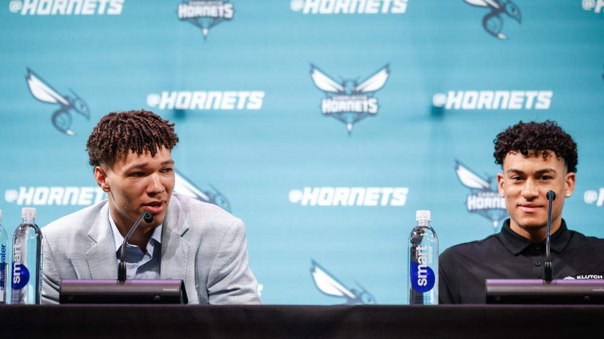 The Hornets’ 2024 NBA Draft picks, Tidjane Salaün, left, and KJ Simpson, are introduced during a press conference at Lowe’s Tech Hub in Charlotte on Friday, June 28, 2024.