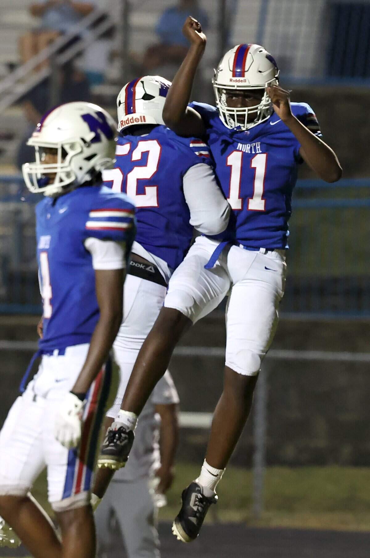 North Meck quarterback Antonio Jenkins, right, is congratulated by lineman Jaden George, left, following a touchdown run during action against Hunter Huss on Friday, September 5, 2025 at North Mecklenburg High School..