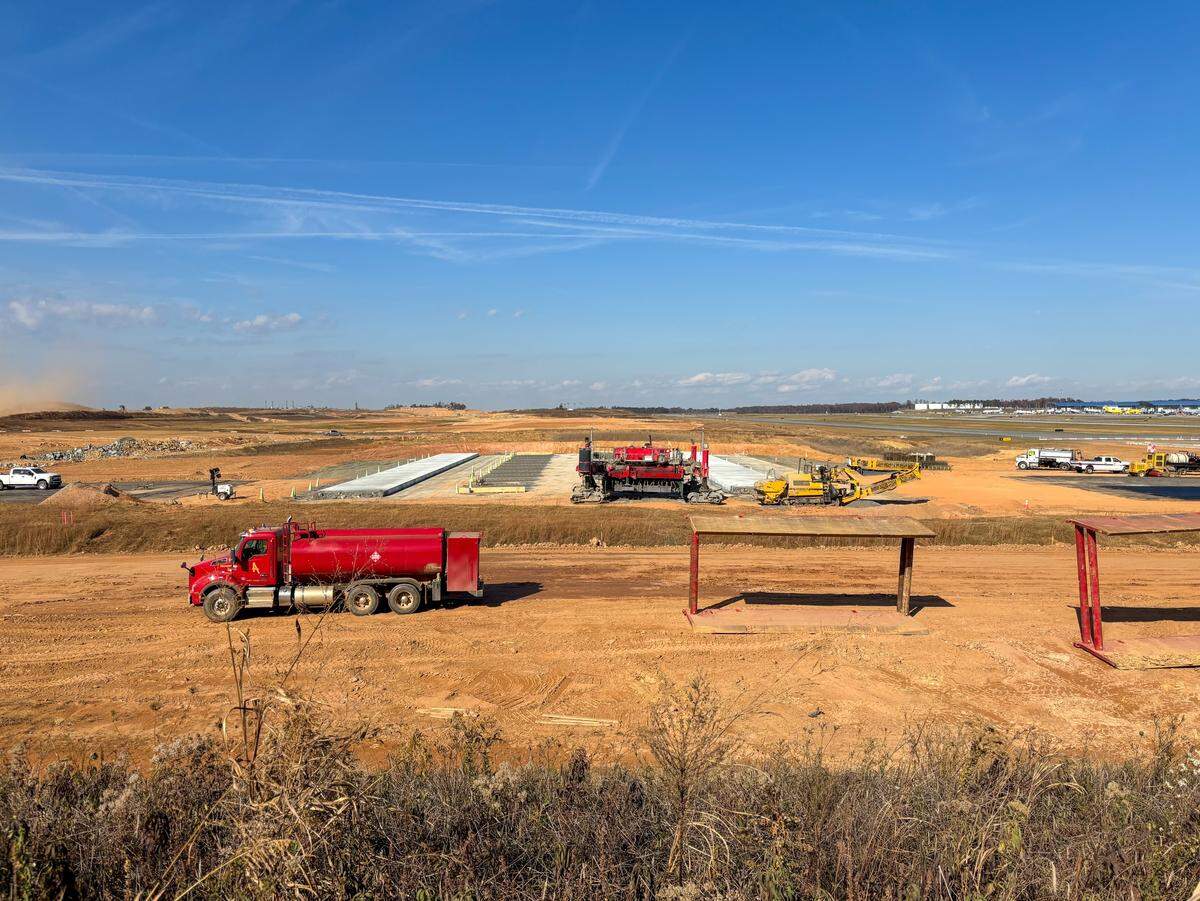 Charlotte Douglas International Airport is working to add a fourth parallel runway project costing more than $1 billion. Construction crews placed the first lane of concrete in late November.