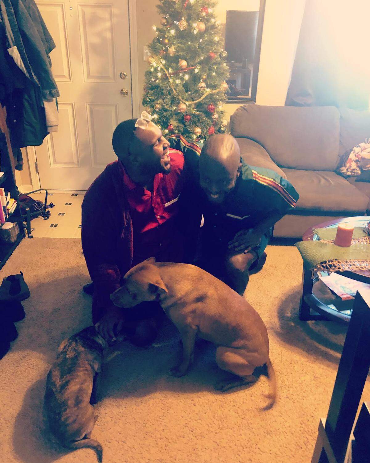 Rogerick Llevon Currie and Jamil Brown with their dogs. Brown said he and Currie were in a romantic relationship off and on, but always remained friends.