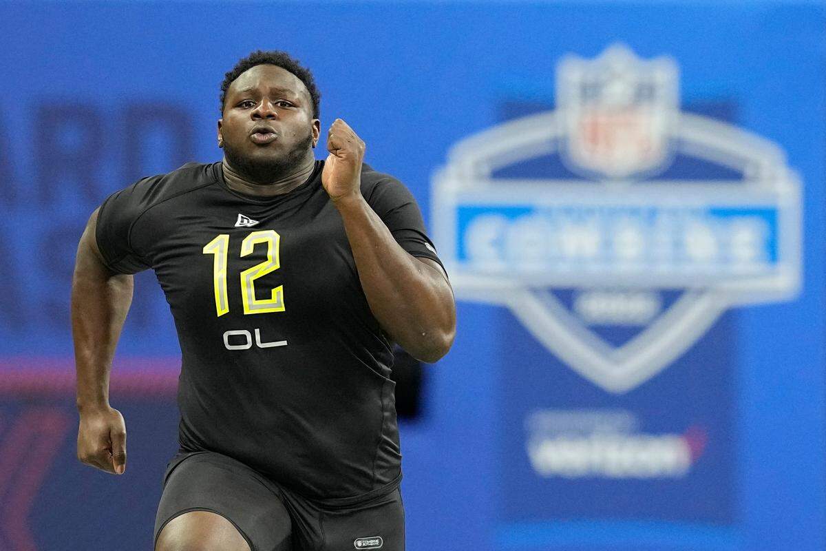 North Carolina State offensive lineman Ickey Ekwonu runs the 40-yard dash during the NFL football scouting combine, Friday, March 4, 2022, in Indianapolis. (AP Photo/Darron Cummings)