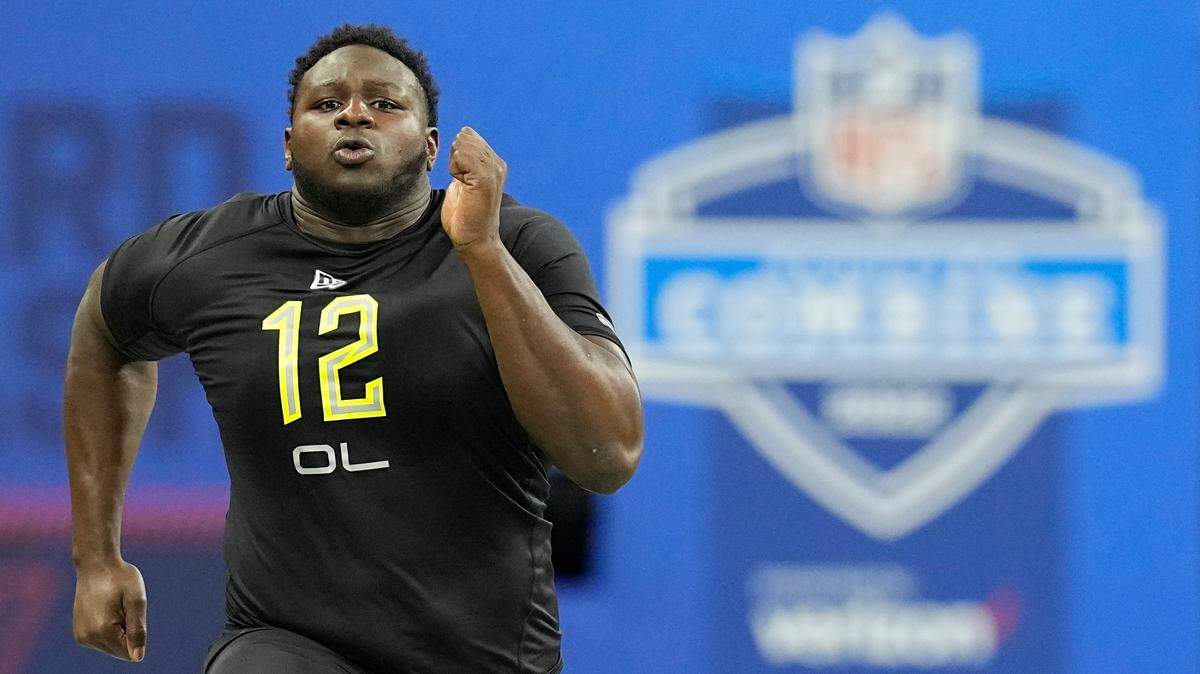 North Carolina State offensive lineman Ickey Ekwonu runs the 40-yard dash during the NFL football scouting combine, Friday, March 4, 2022, in Indianapolis. (AP Photo/Darron Cummings)