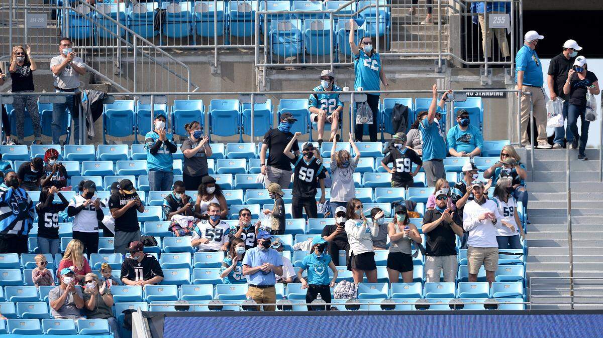 Carolina Panthers fans react to a touchdown reception by tight end Ian Thomas during third quarter action against the Arizona Cardinals on Sunday, October 4, 2020 at Bank of America Stadium in Charlotte, NC. The Panthers defeated the Cardinals 31-21.