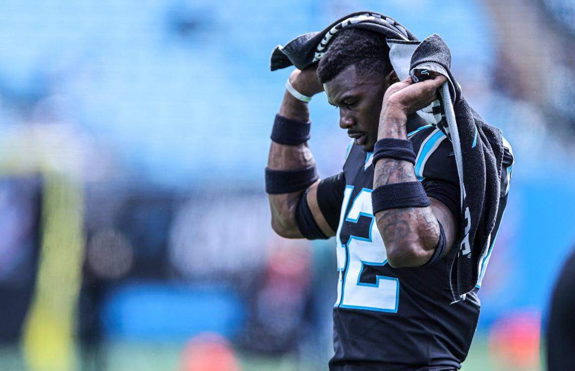 Carolina Panthers Sam Franklin puts a towel on his shoulders before the game against the Philadelphia Eagles at the Bank of America Stadium in Charlotte, N.C., on Sunday, October 10, 2021.