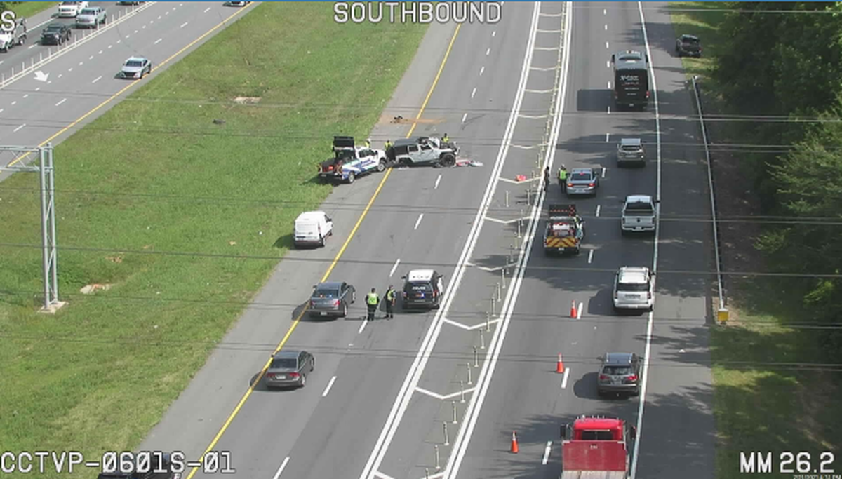 This screenshot from a N.C. Department of Transportation camera shows multiple lanes of the interstate shut down near mile marker I-77 near Cornelius. A Jeep going north lost control in the express lanes before jumping the median into the southbound lanes.