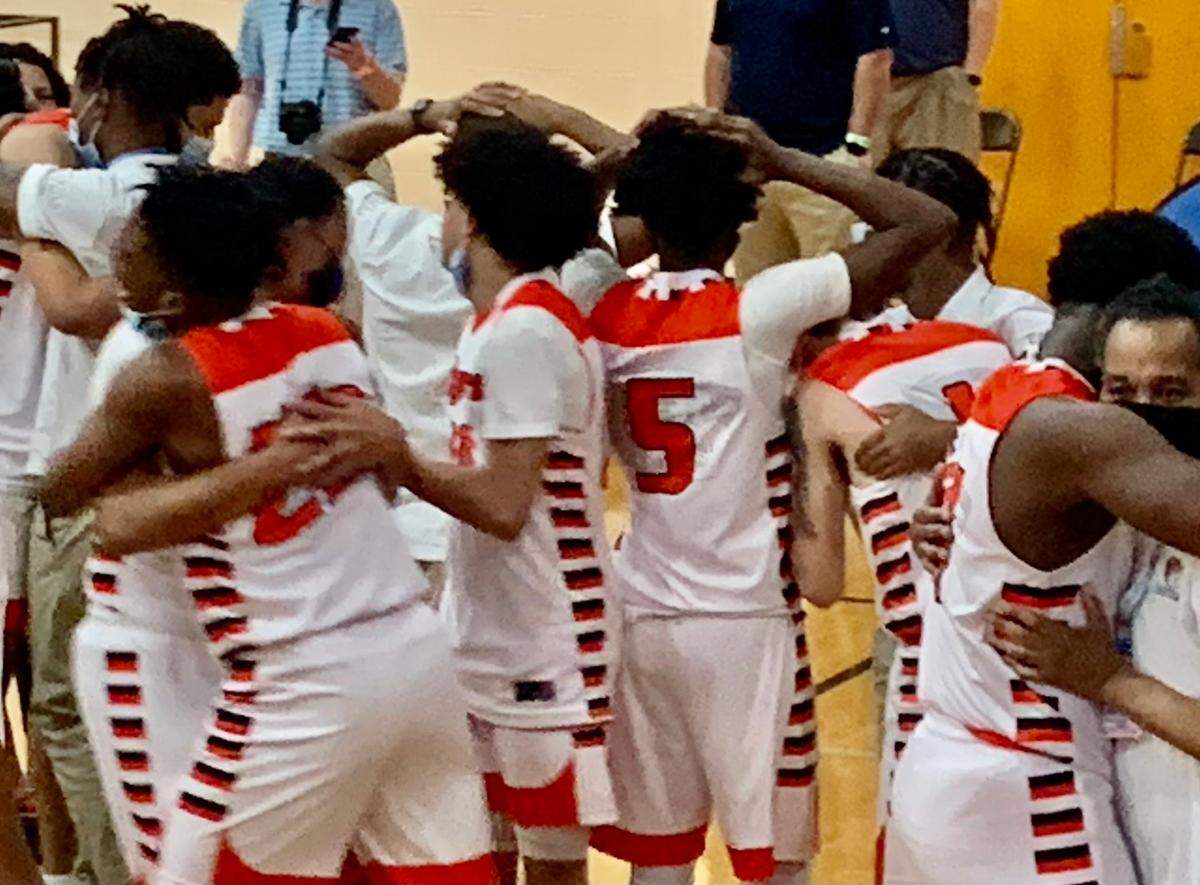 Wilson Prep players react after winning the school’s first state championship in any sport, beating Lincoln Charter 66-58 in the 1A men’s championship game Saturday, March 6, 2021.