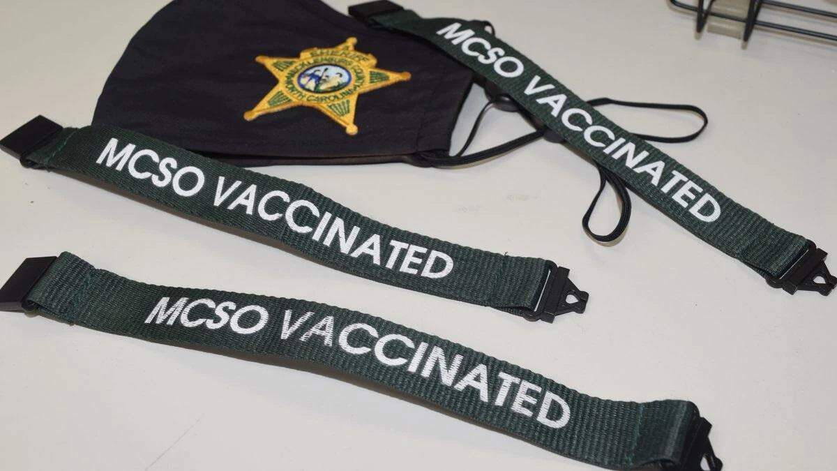 Mecklenburg County Sheriff’s Office employees who are fully vaccinated are wearing these “MCSO Vaccinated” wristbands.