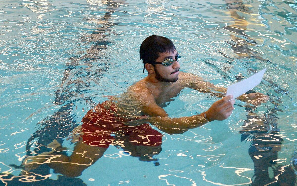Angel Cabrera Paulino, 20 went under water in the deep end of the lap pool to retrieve a clue to a murder mystery at Eastway Regional Recreation Center. A Mecklenburg County Park and Recreation department program entitled, Aquatic Mystery Solvers, gathered Aquatic Recruiting Team members to test drive the program on Saturday, Dec. 07, 2024. The program is open to folks ages 14-99, wishing to sharpen their in-water skills while finding clues to the mystery.