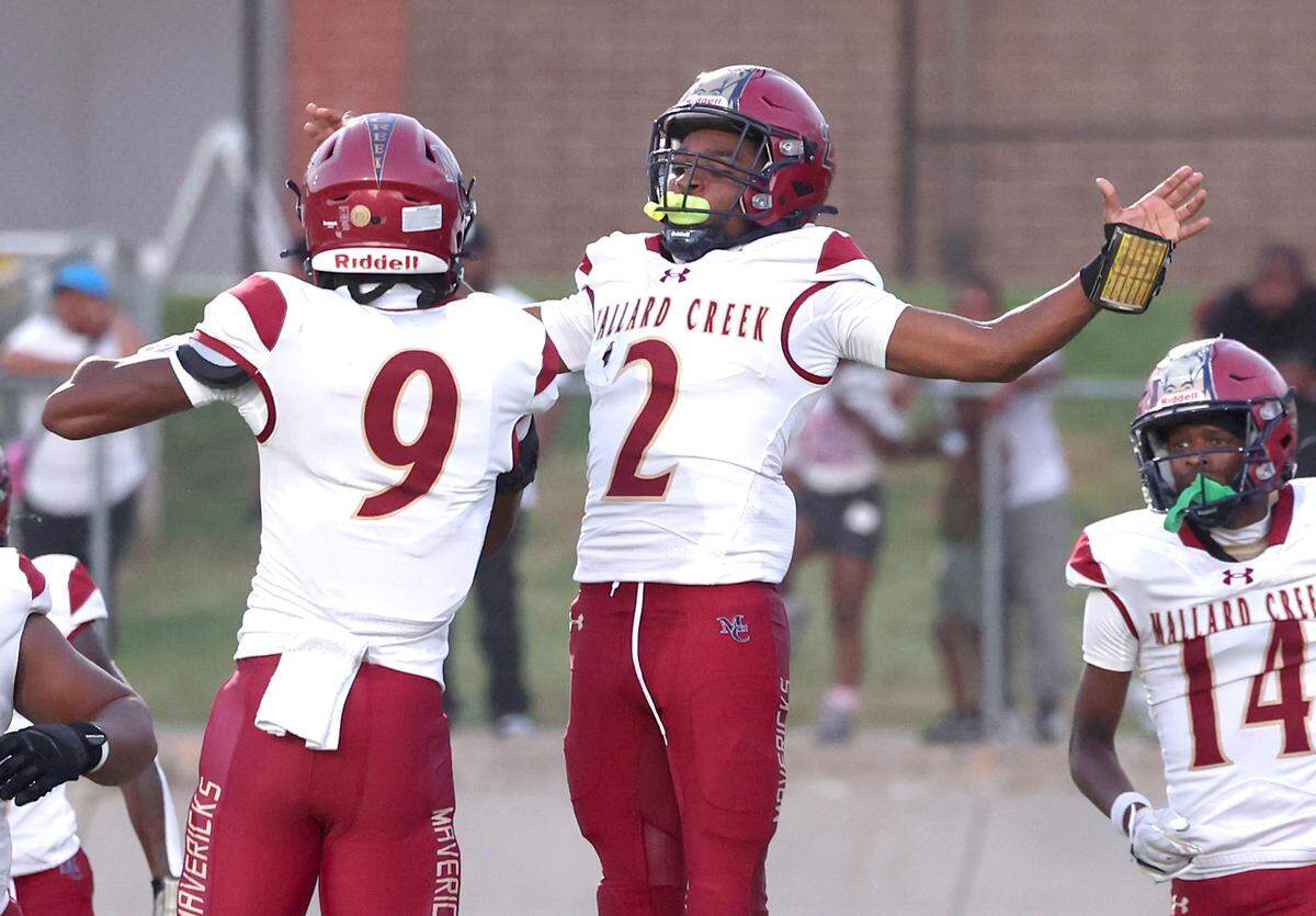 Mallard Creek Mavericks Caleb Knight, right, celebrates his touchdown run with teammate Elijah Thompson, left, during action against West Charlotte on Friday, September 20, 2024 at West Charlotte High in Charlotte, NC.