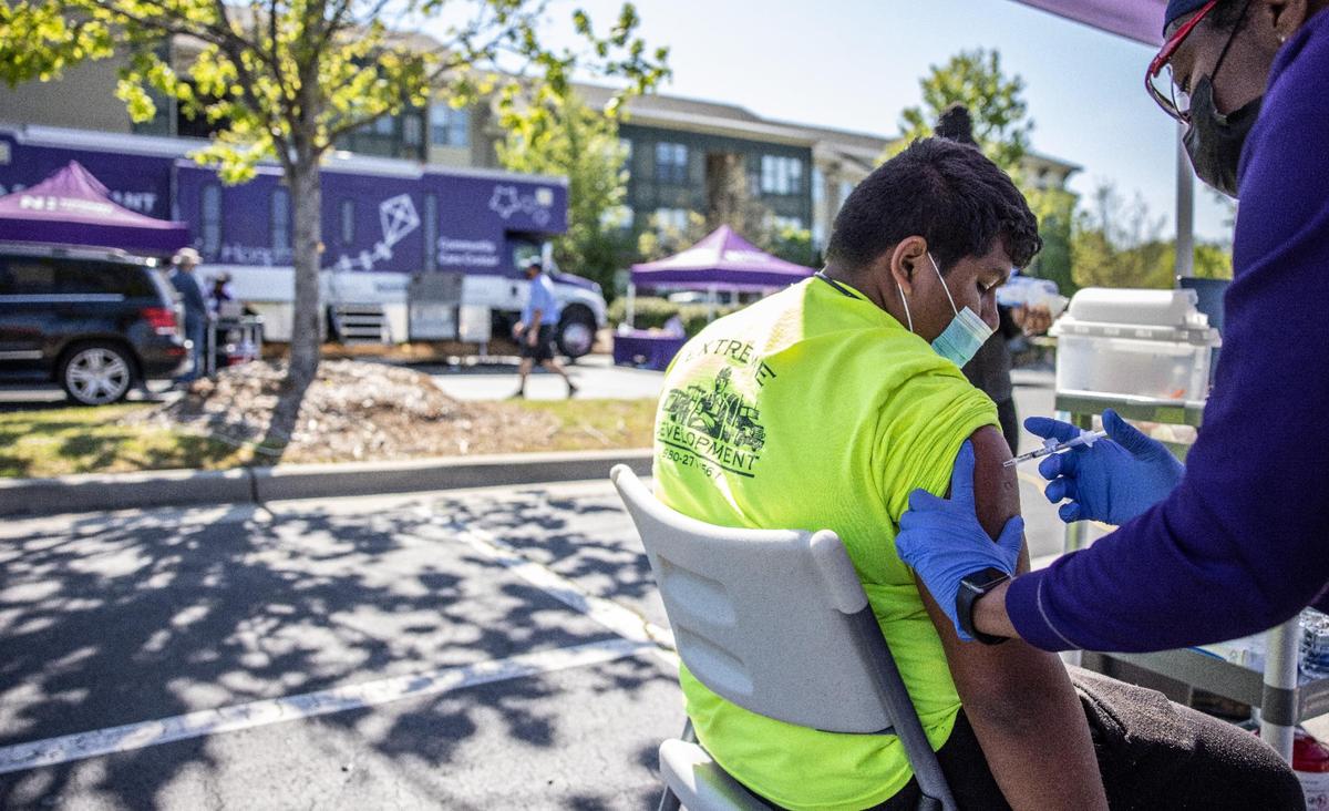 Novant Health hosted a mobile vaccination cinic at Lowe's at Northlake to boost COVID-19 vaccination rates in underserved areas.