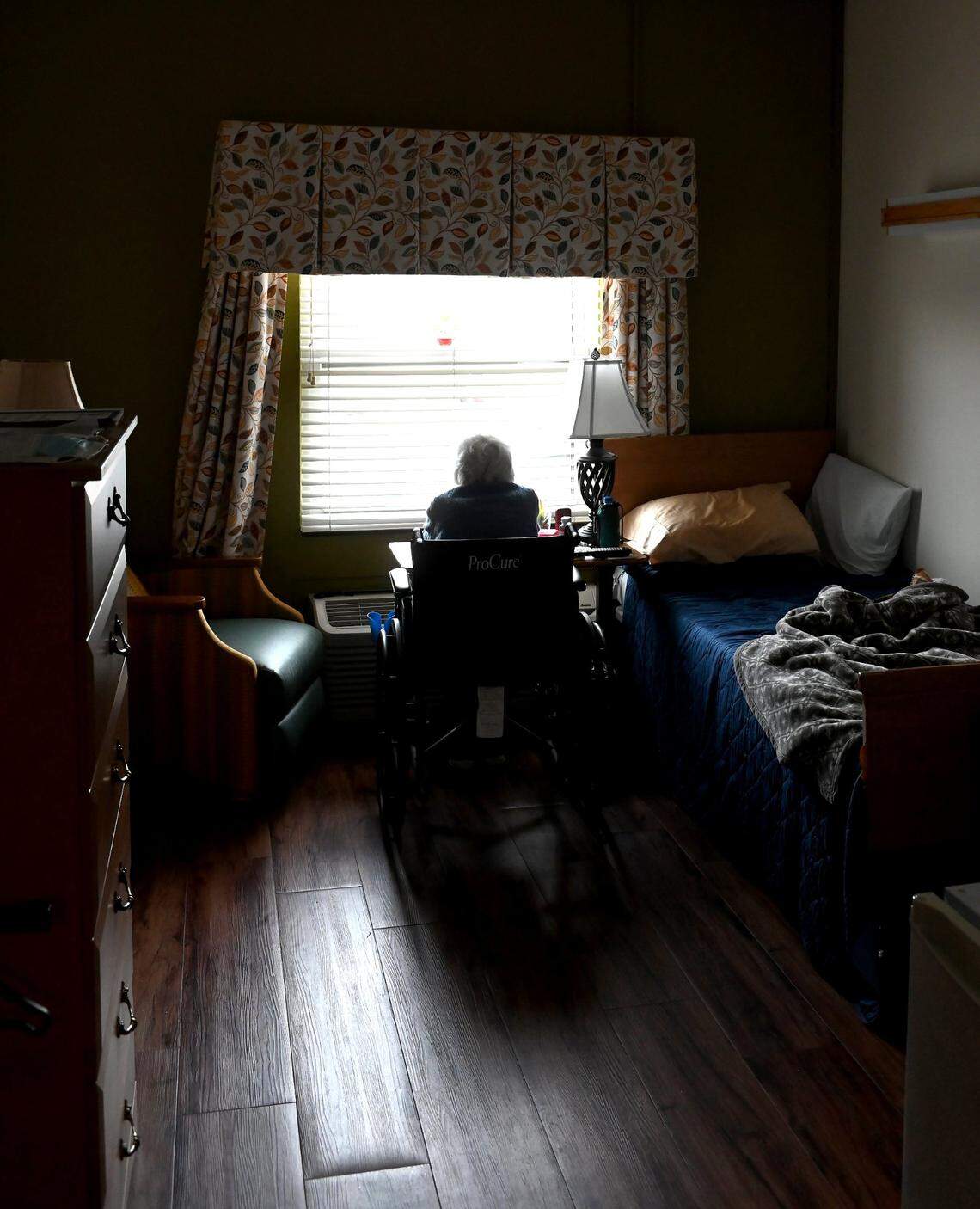 A resident sits in her room at a Salisbury nursing home. North Carolina’s nursing homes won’t be able to provide substantially more staffing until Medicaid reimbursement is increased, industry leaders say.