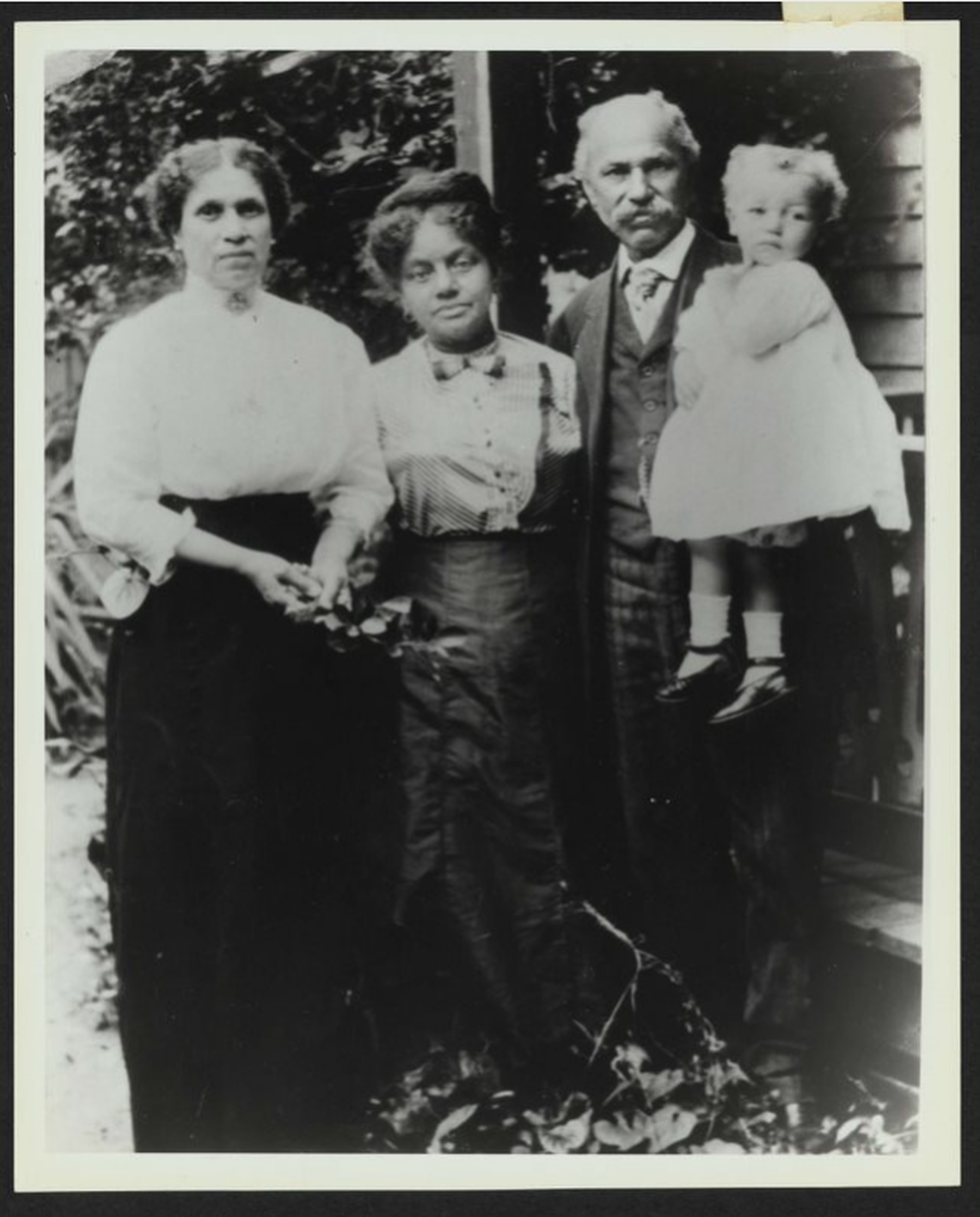 Rosa Kennedy, Cattie Bearden, and Henry Kennedy, who is holding Romare Bearden, circa 1913. The Kennedys are his great-grandparents, and Cattie Bearden is Romare’s grandmother.