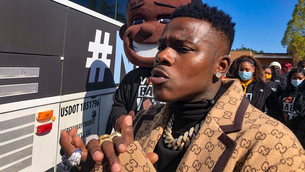 Jonathan Kirk, better known as DaBaby, talks to voters at a #NOCAP2020 bus tour at Mallard Creek Elementary School in Charlotte, NC, on Tuesday, November 3, 2020. DaBaby has been making appearances throughout Charlotte to encourage young voters to get out and vote on Election Day.