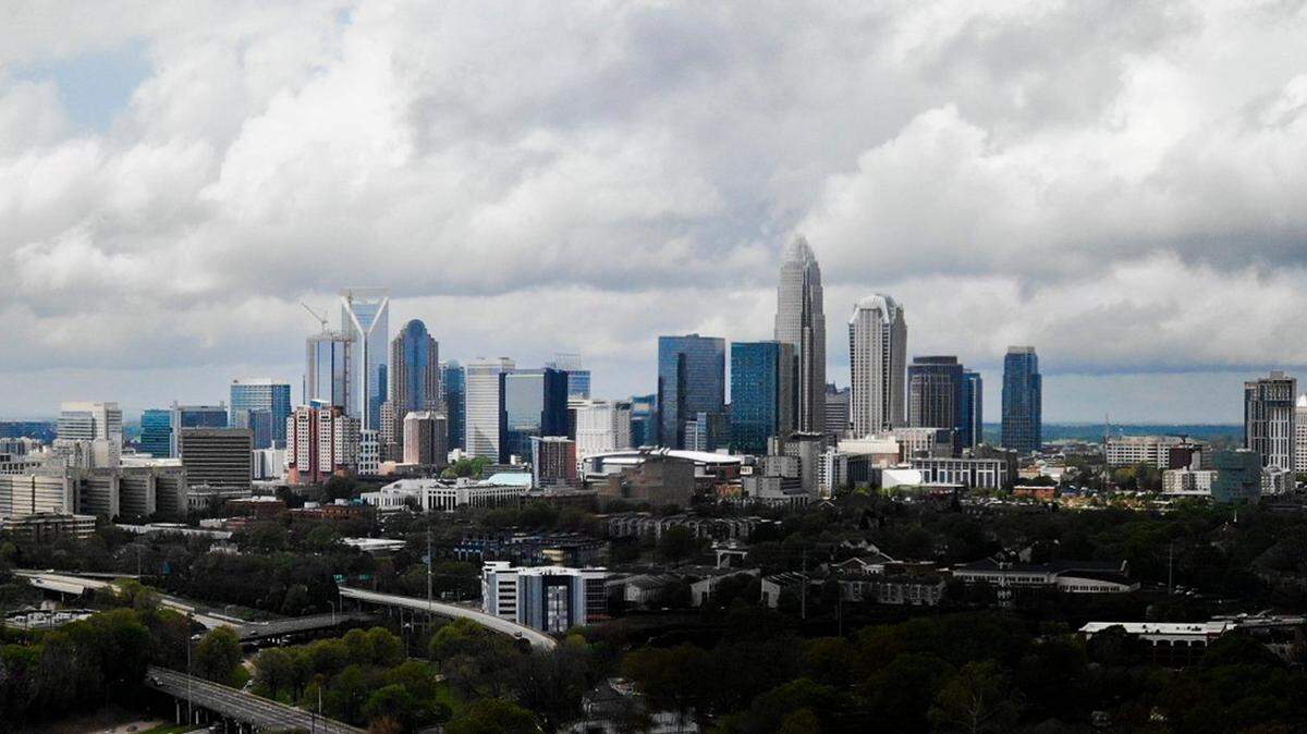 A composite image shows rain clouds over the skyline in Charlotte, NC, on Thursday, April 7, 2022.