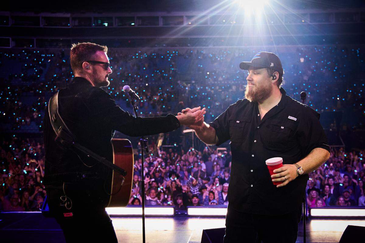 Eric Church (left) and Luke Combs perform on stage during the Concert for Carolina at Bank of America Stadium in Charlotte on Oct. 26.