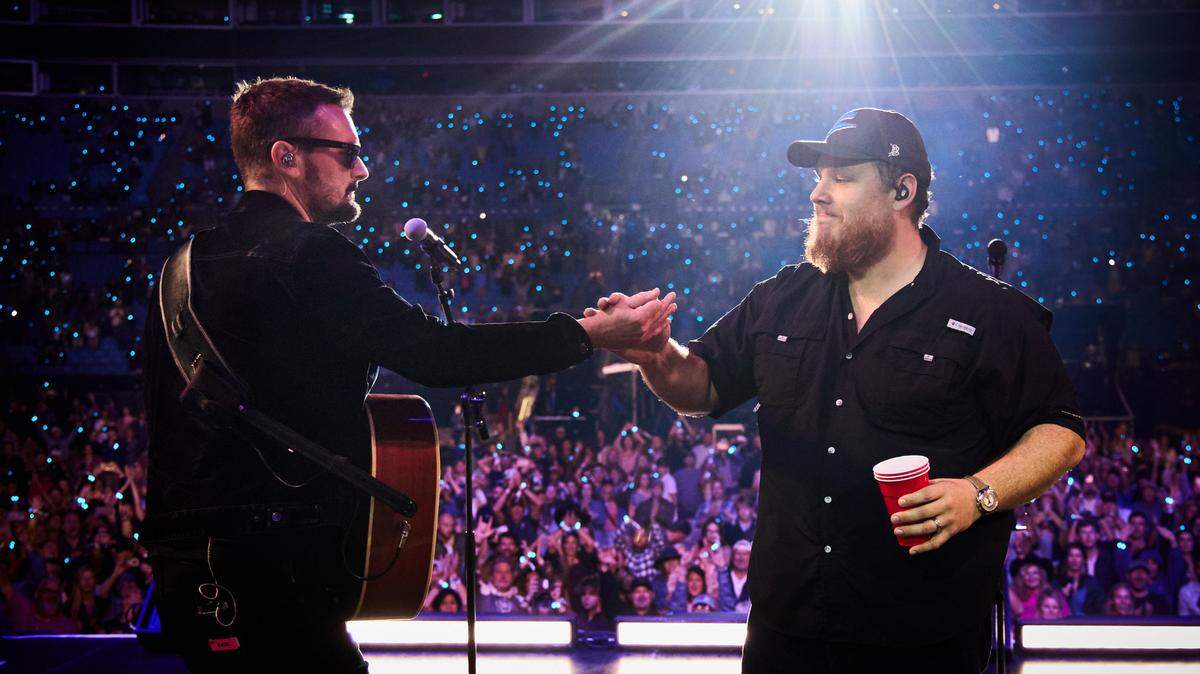 Eric Church (left) and Luke Combs perform on stage during the Concert for Carolina at Bank of America Stadium in Charlotte on Oct. 26.
