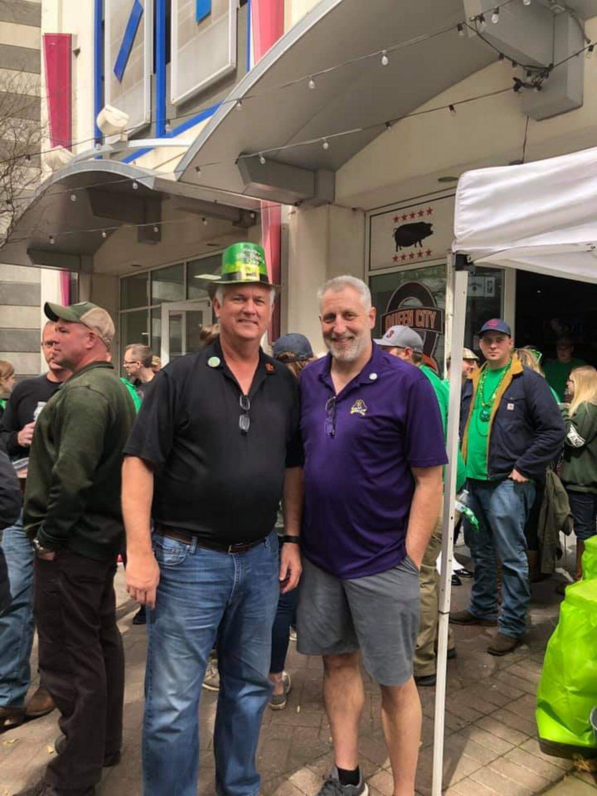 Bryan Meredith (left), managing partner of Queen City Q, and his business partner, Craig Utt (right) at an annual Saint Patrick’s Day celebration hosted at the restaurant. Queen City Q struggled after COVID-19, the loss of the RNC and a temporary closure due to protests, and the restaurant is closed for good.