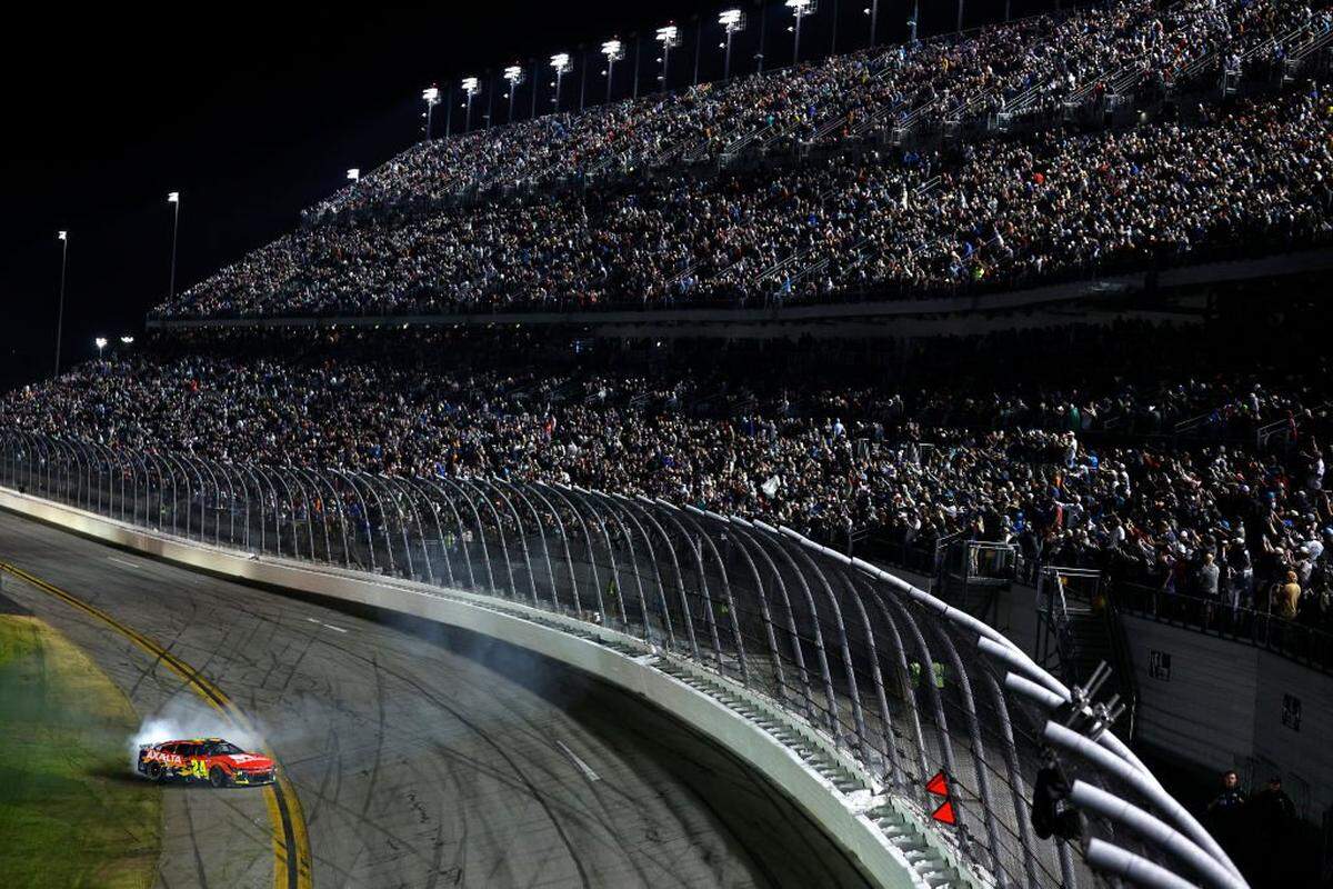 DAYTONA BEACH, FLORIDA - FEBRUARY 16: William Byron, driver of the #24 Axalta Chevrolet celebrates with a burnout after winning the NASCAR Cup Series Daytona 500 at Daytona International Speedway on February 16, 2025 in Daytona Beach, Florida. (Photo by Sean Gardner/Getty Images)