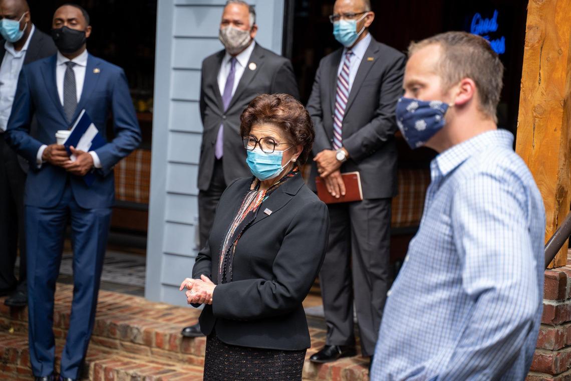 SBA Administrator Jovita Carranza discusses PPP loans and reopening businesses in the backyard of the Goodyear House in NoDa during the COVID-19 pandemic.
