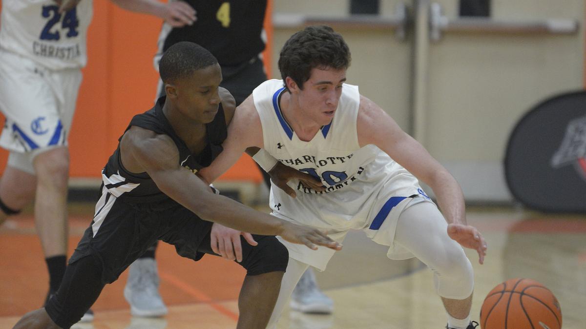 West Charlotte’s Nequay Ware, left,  and Charlotte Christian’s JC Tharrington go after a loose ball as Sweet 16 No. 2 Charlotte Christian faced No. 6 West Charlotte in the feature game of the SE Hoops Festival. Christian features App State recruit JC Tharrington and West Charlotte has the state’s No. 2 overall recruit Patrick Williams.