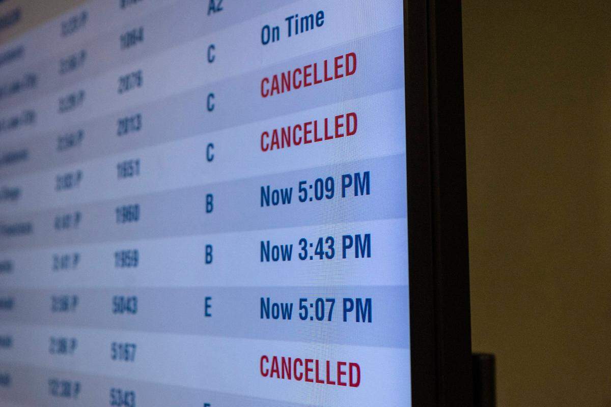 Screens show flight departures and cancellations at Charlotte Douglas International Airport on Saturday, January 22, 2022 in Charlotte, NC. Another bout with winter weather may be behind dozens of flight cancellations at CLT for Saturday, Jan. 29.