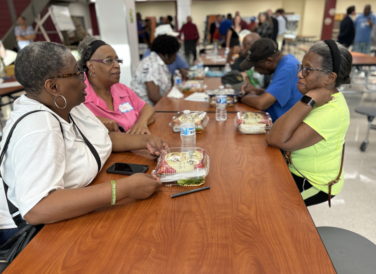 Second Ward alumni and community members gather Wednesday June 27, 2024 at West Charlotte High School for the Second Ward community information meeting.